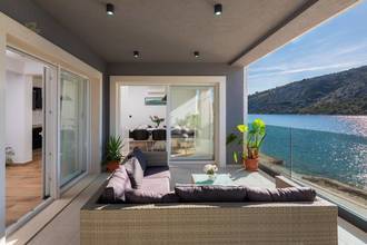 Thumbnail von Modern new-build villa in the first row to the sea with a swimming pool on the roof terrace