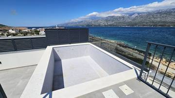 Thumbnail von Modern penthouses on the top floor with a roof terrace and pool right by the sea