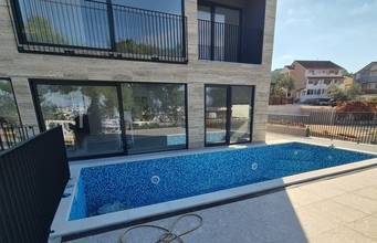 Thumbnail von Modern villa with swimming pool in the first row to the sea / marina