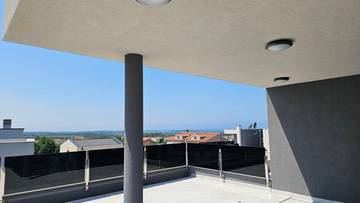 Modern penthouse with roof terrace and sea view