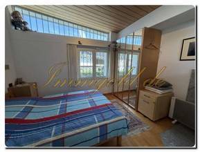 Thumbnail von Modernly renovated, exclusive, single-story detached house with a breathtaking lake view in a sunny, peaceful location.
