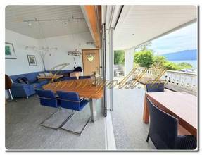 Thumbnail von Modernly renovated, exclusive, single-story detached house with a breathtaking lake view in a sunny, peaceful location.