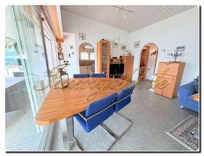 Thumbnail von Modernly renovated, exclusive, single-story detached house with a breathtaking lake view in a sunny, peaceful location.