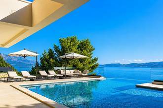 Thumbnail von Impressive luxury villa directly on the sea with an infinity pool and wellness area