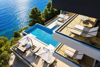 Thumbnail von Impressive luxury villa directly on the sea with an infinity pool and wellness area