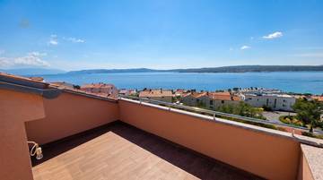 Maisonette apartment with sea view, two terraces, and garage