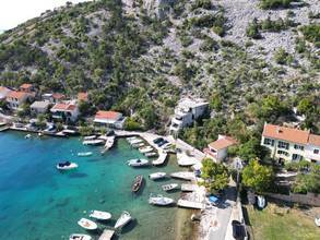 Semi-detached house in the first row to the sea with boat dock (usage), garden, and garage