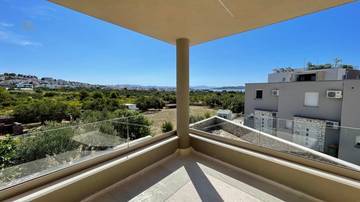 New build apartment with sea view, three bedrooms, and covered terrace near the beach