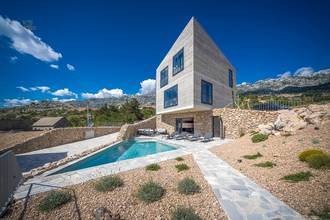 Modern villa with swimming pool and sea view below Velebit