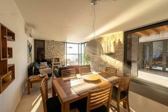 Thumbnail von Well-maintained stone house directly on the water, two units, saltwater pool