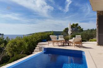 Thumbnail von Well-maintained stone house directly on the water, two units, saltwater pool