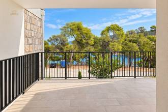 Thumbnail von New garden apartments on a hillside with a view of the water, terraces, and parking space.