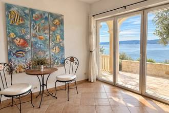 Thumbnail von Well-maintained holiday property with guest studios and a konoba, ten meters to the shore.