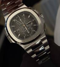  Patek Philippe Nautilus Steel Traveltime Chronograph 5990/1A - New - Fullset 2016 